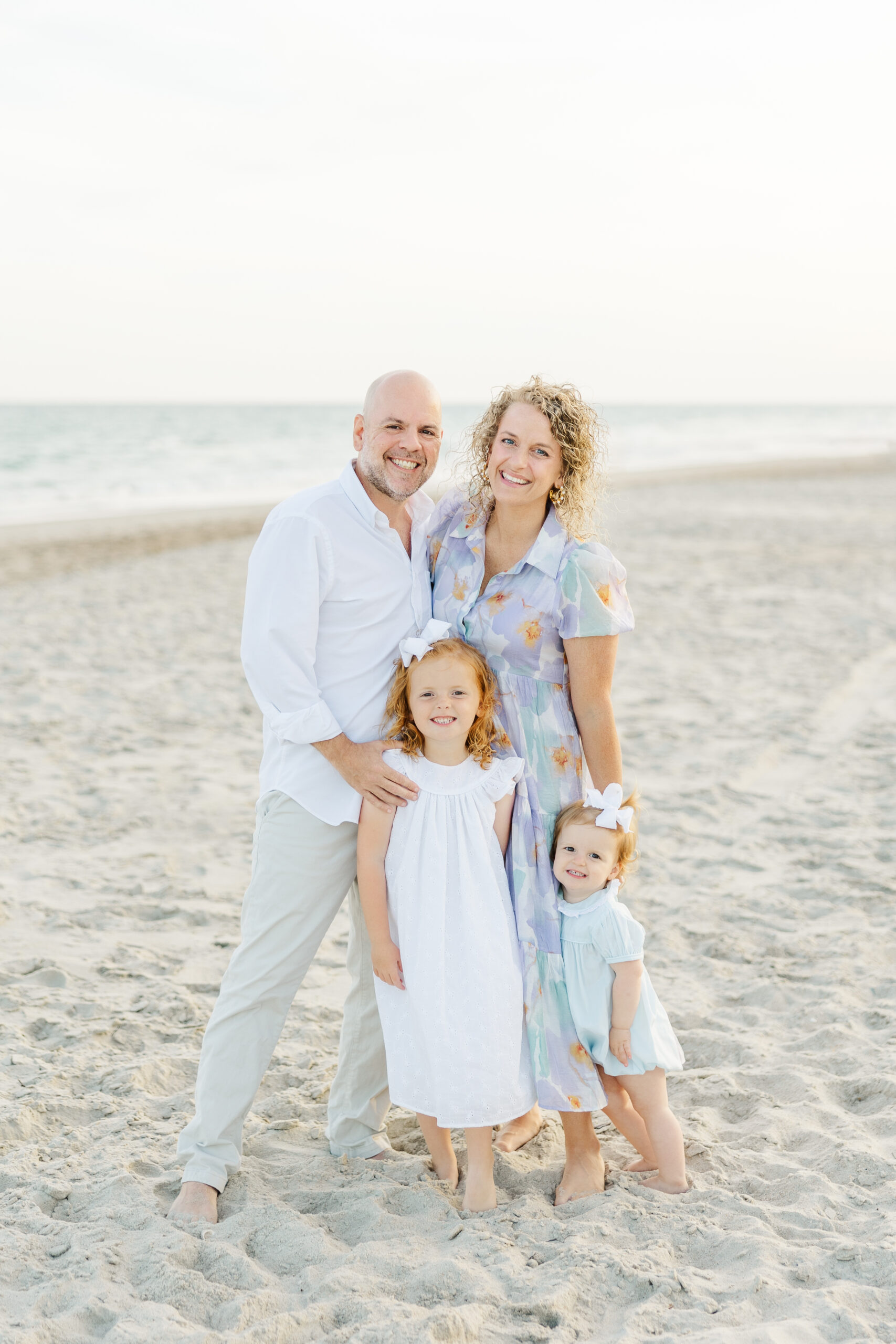 emerald isle nc beach photographer family with toddlers smiling on beach